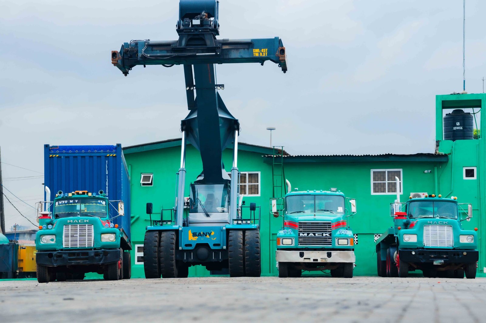 Reach stacker handling a container at a Hezegovin holding bay